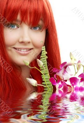 lovely redhead with orchid in water