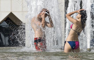 Young couple in fountain