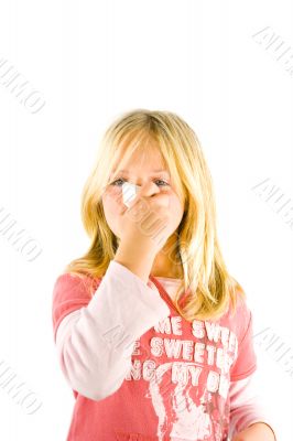 Young blond girl sneezing in the handkerchief Young blond girl sneezing in the handkerchief