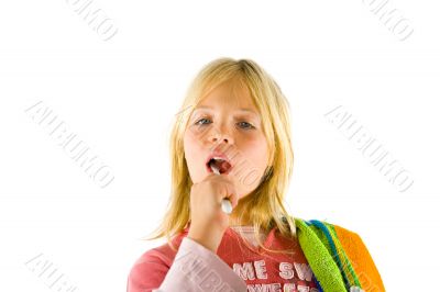 Little girl brushes her teeth