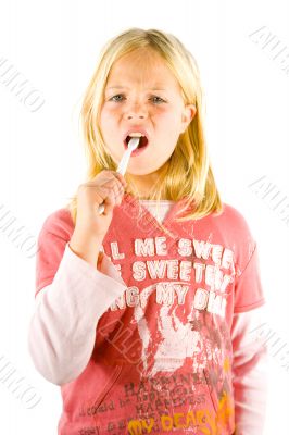 Little girl brushes her teeth