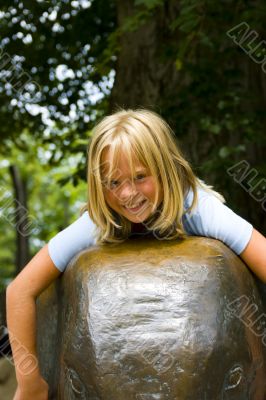 Girl sitting on elephant