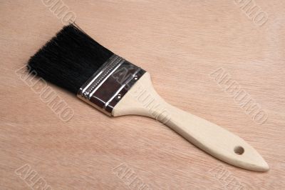 Paint brush on wood background