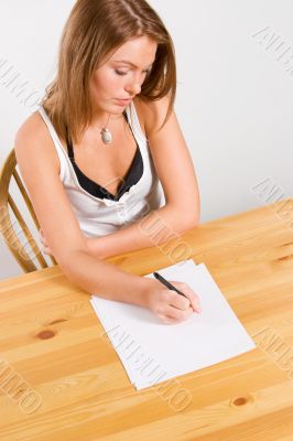 young beautiful woman writing