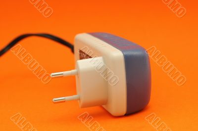 Dark blue adapter on an orange background