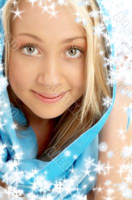 smiling blond in blue scarf with snowflakes