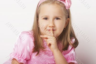 Nice young girl in pink on light background