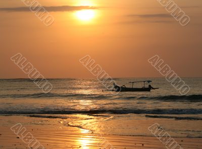 Drifting boat on a sunset
