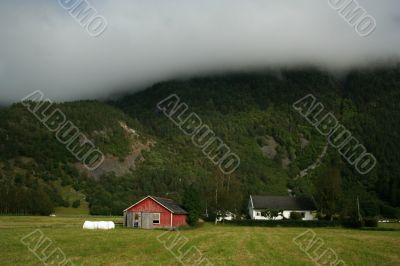 Rural norway andscape with mountain and houses Rural norway andscape with mountain and houses