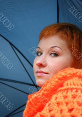 young red-haired woman with umbrella