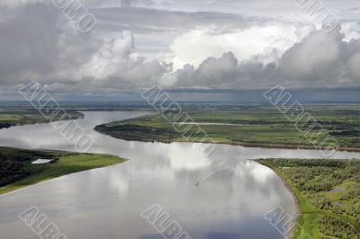 Clouds over big river.