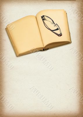 old blank book and glasses