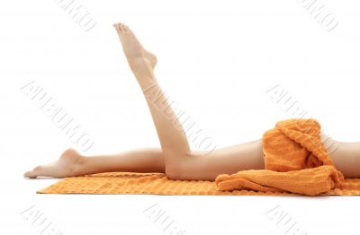 long legs of relaxed lady with orange towel 2