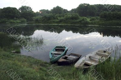 three boats on river