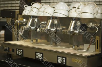 Real coffee machine and clean cups in a cafe