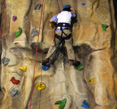 Little boy Climbing A Wall