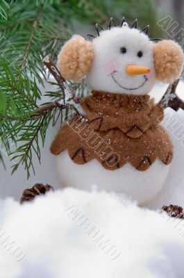 Christmas snowball on a snow with a fur-tree