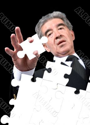 business man solving a puzzle