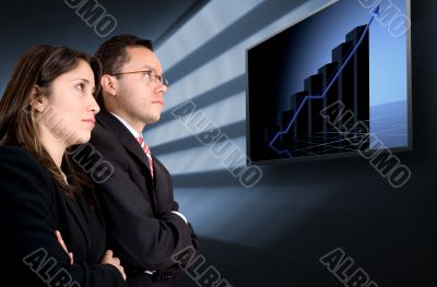 business partners watching their success