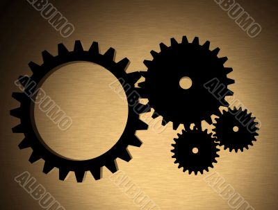 cogwheels over a gold metal texture