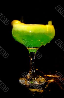 cold green drink in transparent glass