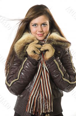 A smiling beautiful girl in winter clothes