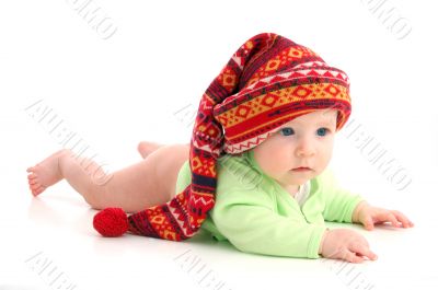 a little baby in a large red hut portrait