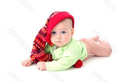 a little baby in a large red hut portrait