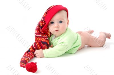 a little baby in a large red hut portrait