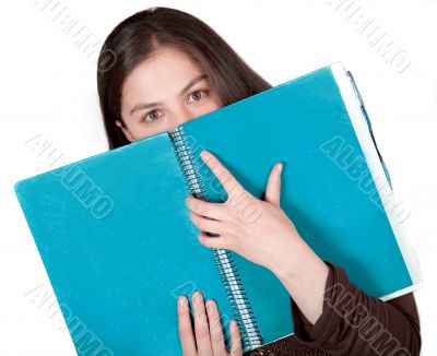 beautiful student hugging a notebook