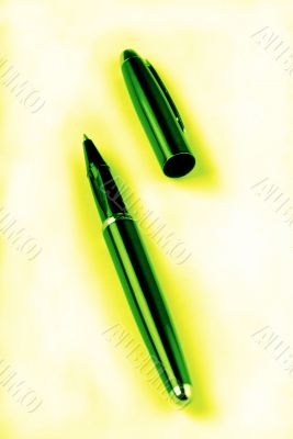 pen on yellow-green background