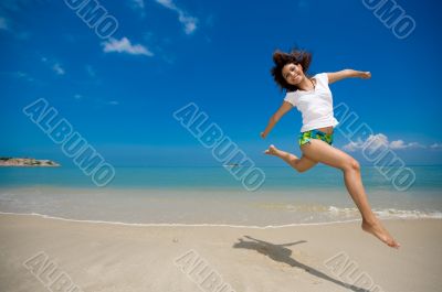 happy jump at the beach