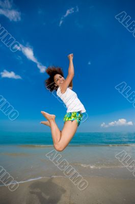 happy jump at the beach