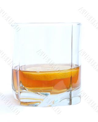 Cognac in a glass, with lemon