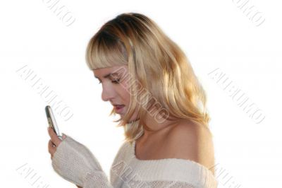 Young blond woman sms by mobile phone