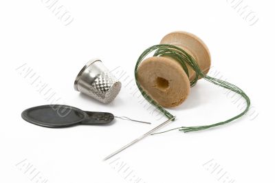 Thread, thimble and needle