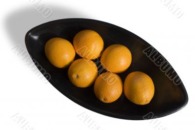 Oranges into black Japanese vase 2
