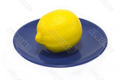 Lemon served on a blue plate