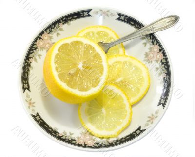 Sliced lemon served on ornamented plate 1