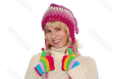 Smiling blond girl in cap and Multi-coloured gloves