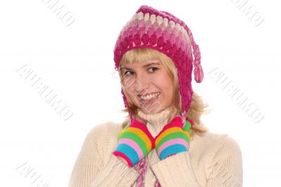 Smiling blond girl in cap and Multi-coloured gloves
