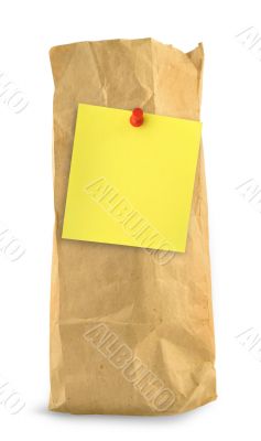 brown paper bag with yellow note