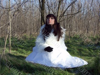 The young bride in a white dress on the nature 1