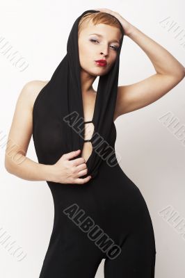 sexy blond girl standing in black dress