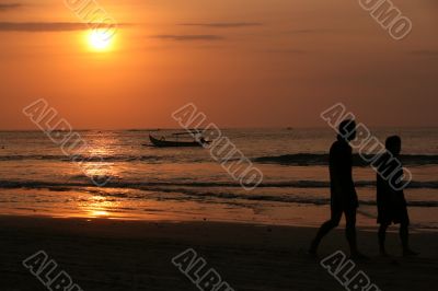 Drifting boat on a sunset