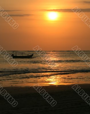 Drifting boat on a sunset