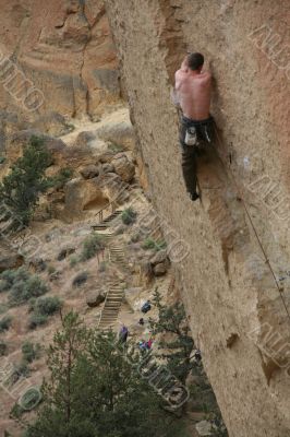 Climber on overhanging cliff route