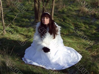 The young bride in a white dress on the nature 2