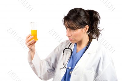 Female doctor examining test flasks