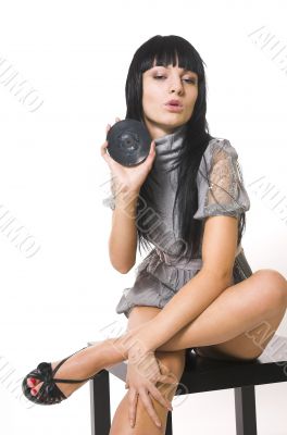 The beautiful brunette with a vinylic plate The beautiful brunette with a vinylic plate